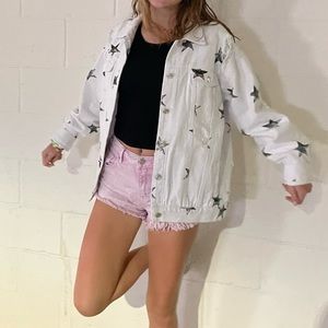 oversized white jean jacket with black stars